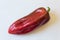 Bright red Capsicum annuum Cubanelle pepper, Cuban pepper, Italian frying pepper, food ingredient, isolated on white, horizontal
