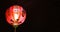 Bright red chinese lantern at night, with black background