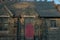 A Bright Red Door in a Cobblestone Church With Steps Leading Up to It