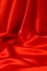 Bright red fabric with large folds for background