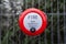 Bright red fire alarm bell turn handle spin around to operate alert manual steel ringing on construction building site