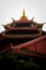 Bright red mosque with a tiered roof, notable for its unique, Chinese-inspired architecture