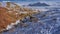 Bright red-orange hills and snow-capped mountains