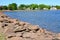 Bright red rocks forming barrier along Charlottetown Harbour