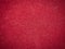 Bright red velour paper texture. Velvet surface, close up