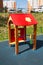 Bright red wooden house on the Playground, sports and entertainment