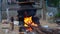 Bright reddish fire view  burning in clay stove  with wooden pieces. Traditional way to cook food in rural area. Rural India