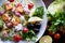 Bright salad with feta cheese and tomato and tender