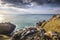 Bright scenery of an ocean with a mountain at the shore in Mining Ruins, Botallack, Cornwall, UK