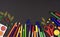 Bright school supplies on blackboard background. Back to school concept