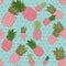 Bright seamless carmine pink with green pineapple pattern, on a light blue background with rhombuses