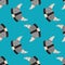 Bright seamless nordic pattern with grey colored viking helmet silhouettes. Blue background. History skull ornament