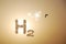 bright shining sun with a black bird and h2 hydrogen letters