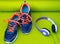 Bright Shoes and Headphones on Rolled Yoga Mat