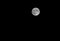 bright silvery moon with lunar craters visible to the naked eye