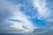 Bright sky with blurry clouds and soaring birds