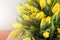 Bright spring bouquet of tulips and mimosa flowers