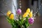 Bright spring bouquet of yellow and purple tulips and branches pussy willows. Easter arrangement of fresh flowers