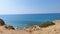 A bright spring day on the beach withe blue sky and sea