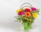 Bright spring gerberas in a gift box or basket on a light background with a place for text, a beautiful gift bouquet