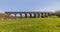 Bright Spring sunshine illuminates the abandoned Helmdon viaduct