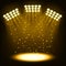 Bright stadium spotlights on dark gold background