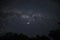 A bright starry night sky and falling stars in the Carpathian mountains