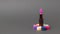 Bright stylish lipstick on a colorful stand on a dark gray background