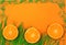 Bright summer banner with tangerines and green grass.