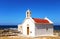 Bright summer photo church near the sea. Greece. Mediterranean Sea. Holidays in Europe. Vacation. Tourism.