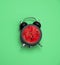 Bright summer square poster vintage  black alarm clock with watermelon inside art collage on a green background