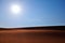 Bright sun, clear blue sky and rippled desert sand. Arabian Desert, Riyadh, Saudi Arabia