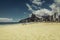 Bright sun on Ipanema Beach with people relaxing against Rio de Janeiro skyline