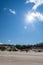 Bright sun in the sky. Sea sand dune. Sea coast. Deserted seashore