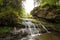 Bright sun. Waterfall. Carpathians. The mountains. The sun.