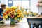 bright sunflowers being sorted by a florist in a shop