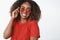Bright sunglasses for any weather. Portrait of charming carefree and charismatic beautiful african-american woman in red