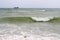 Bright sunny day stormy seascape with white sea foam