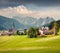 Bright sunny morning in Gosau village with Christianity churh. Colorful outdoor scene in Austrian Alps, Liezen District of Styria,