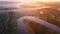 Bright sunny morning  over foggy river. Beautiful aerial landscape