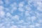 Bright sunny summer sky cloudscape, large detailed blue skies, light clouds background, horizontal copy space