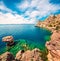 Bright sunny view of Melagavi lighthouse in the Corinth Gulf. Picturesque spring seascape in the Greece, Europe. Beauty of nature