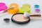 On a bright table, items for makeup, colorful shadows, powder and brushes for applying