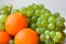 Bright tangerine and a big bunch of green grapes