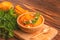 Bright tasty pureed pumpkin soup with ingredients