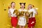 Bright three girls keeping balloons and ice creams