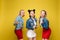 Bright three girls keeping balloons and ice creams