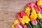 Bright tulips and daffodil flowers holiday background