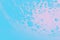 Bright turquoise patchy background with pink spot