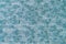 Bright turquoise white melange knitwear wool fabric texture background. Abstract textile backdrop